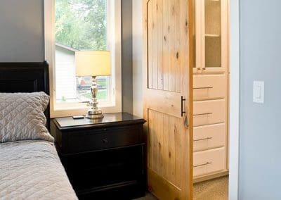 Bedroom barn door at Cabin at Lake Poinsett by Shawn's Custom Homes
